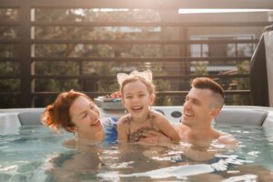 Family have fun in a hot tubs in the summer hoildays in Surrey