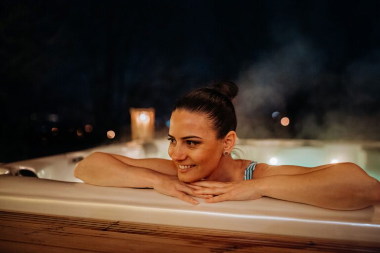 A women enjoys her hot tub in Surrey UK and keeps energy efficiency top of mind