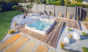 A lovely hot tub is sunken into garden decking in a Surrey UK back garden